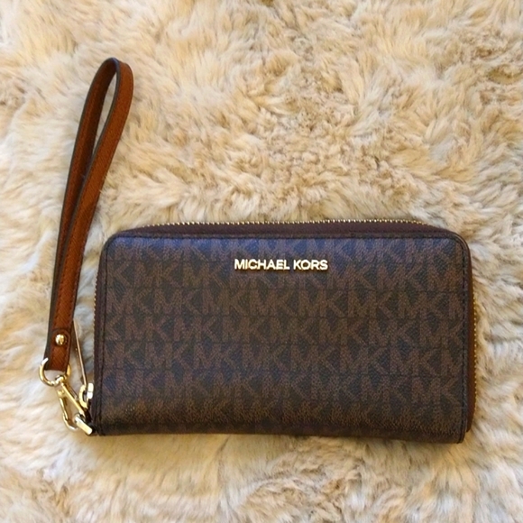 Michael Kors Handbags - VGUC Michael kors phone wallet / wristlet.